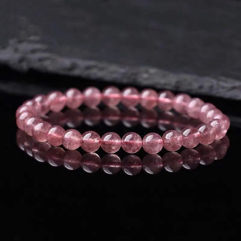 Women's strawberry quartz crystal bracelet with polished beads in three size options