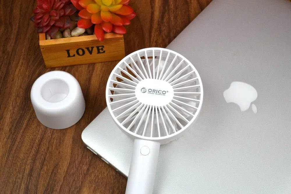 White ORICO FH1 portable USB desk fan with rechargeable battery on a desk