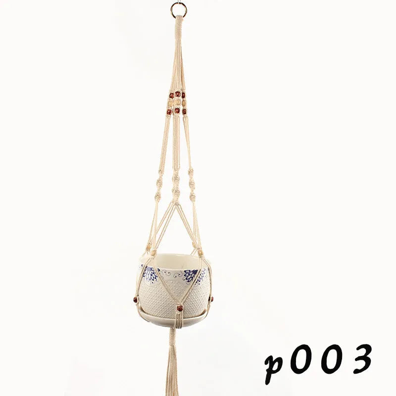 Woven cotton rope plant holder in a desktop style with greenery inside.