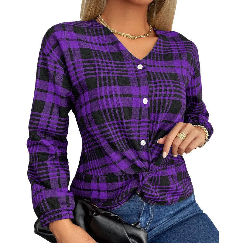 Women's purple loose fit plaid shirt with regular sleeves on a hanger.