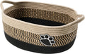 Handmade light beige woven cotton rope storage basket with a wooden handle.