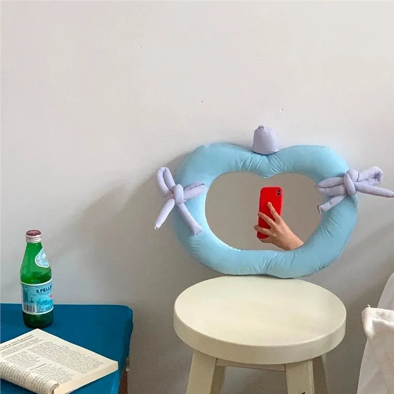 Korean-style decoration mirror with cotton-filled fabric border and aluminium lens in apple colour