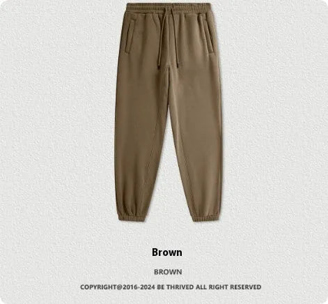 Men's solid colour velvet sweatpants with ankle banding in mid waist design
