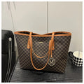 Structured black PU shoulder bag with sewing thread detail and a polyester lining.