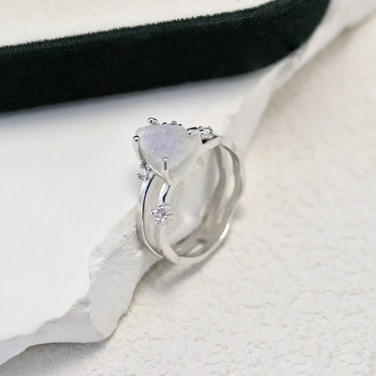 S925 silver ring with triangular shape and central moonstone in rose gold, white, or yellow gold finish.