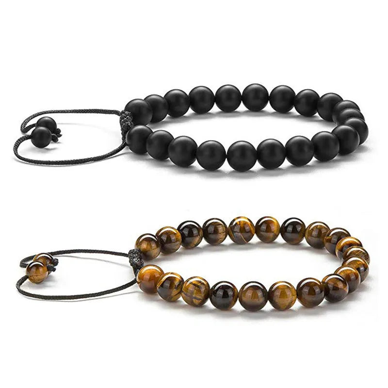 Geometric couple bracelet made of matte black agate beads with a tiger eye stone.