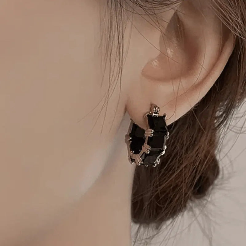 Geometric U-shaped women's earrings with round zircon elements and gold electroplated finish
