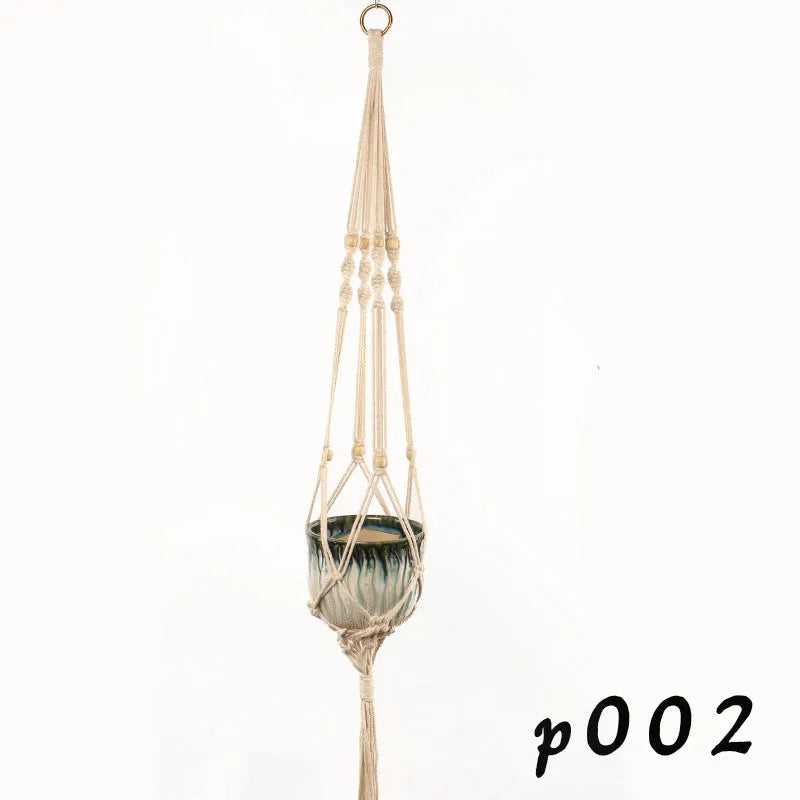 Woven cotton rope plant holder in a desktop style with greenery inside.