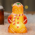 Glowing plastic gingerbread man and snowman Christmas ornament with modern design in red scarf variation