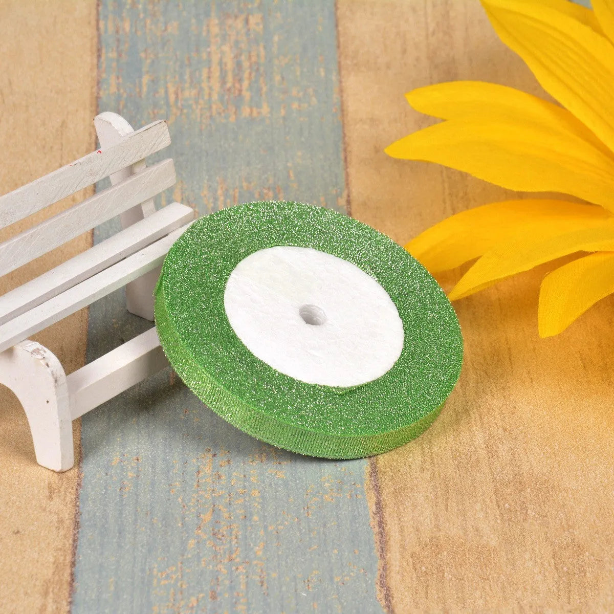Polyester ribbon spool in metallic colours for decorative clothing and gift packaging trim