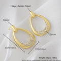 Yellow gold geometric drop earrings for women with round and oval elements, shown with handbag packaging.