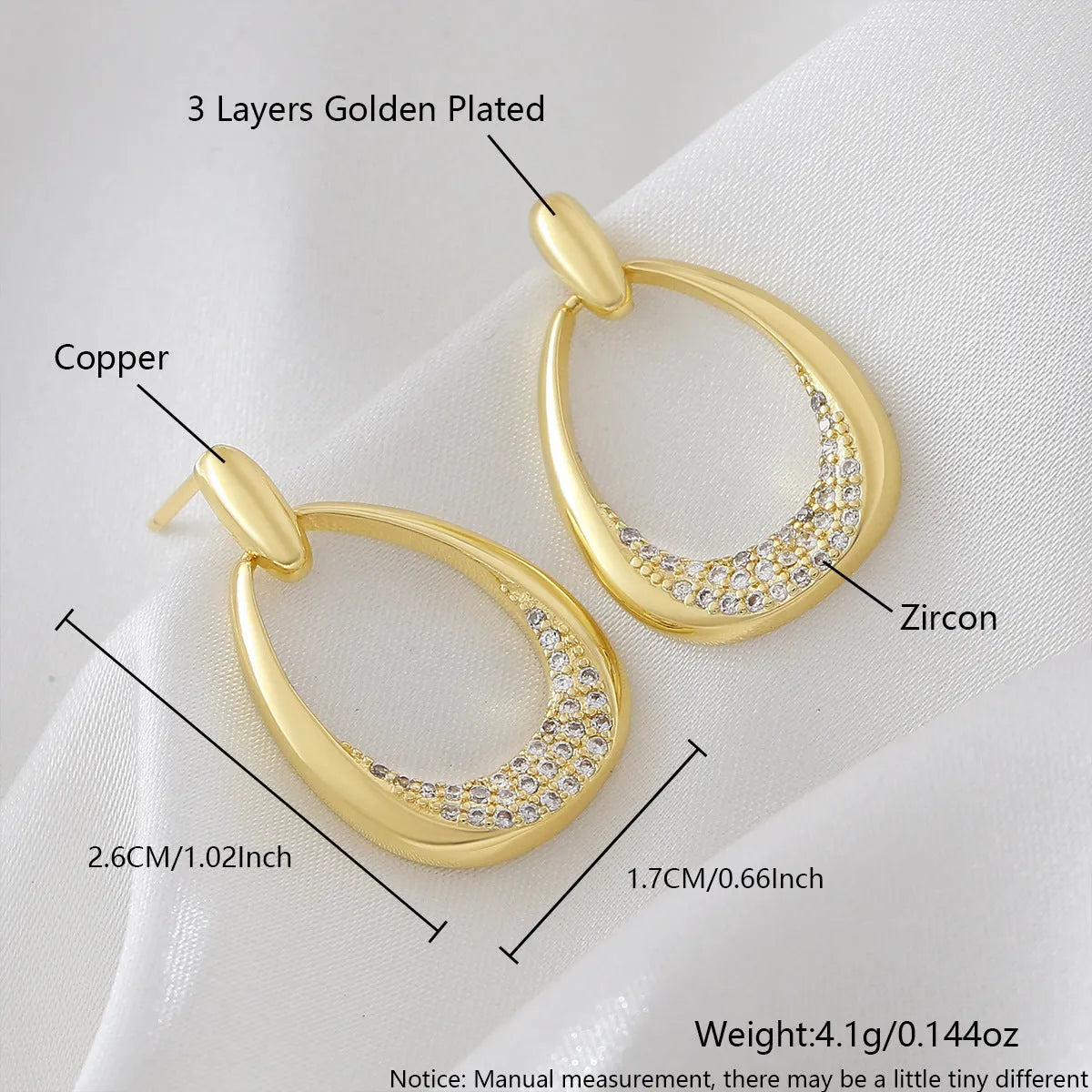 Yellow gold geometric drop earrings for women with round and oval elements, shown with handbag packaging.