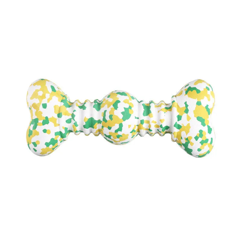 Green, white, and yellow camouflage pattern natural rubber bone chew toy for large breed dogs on a plain background.