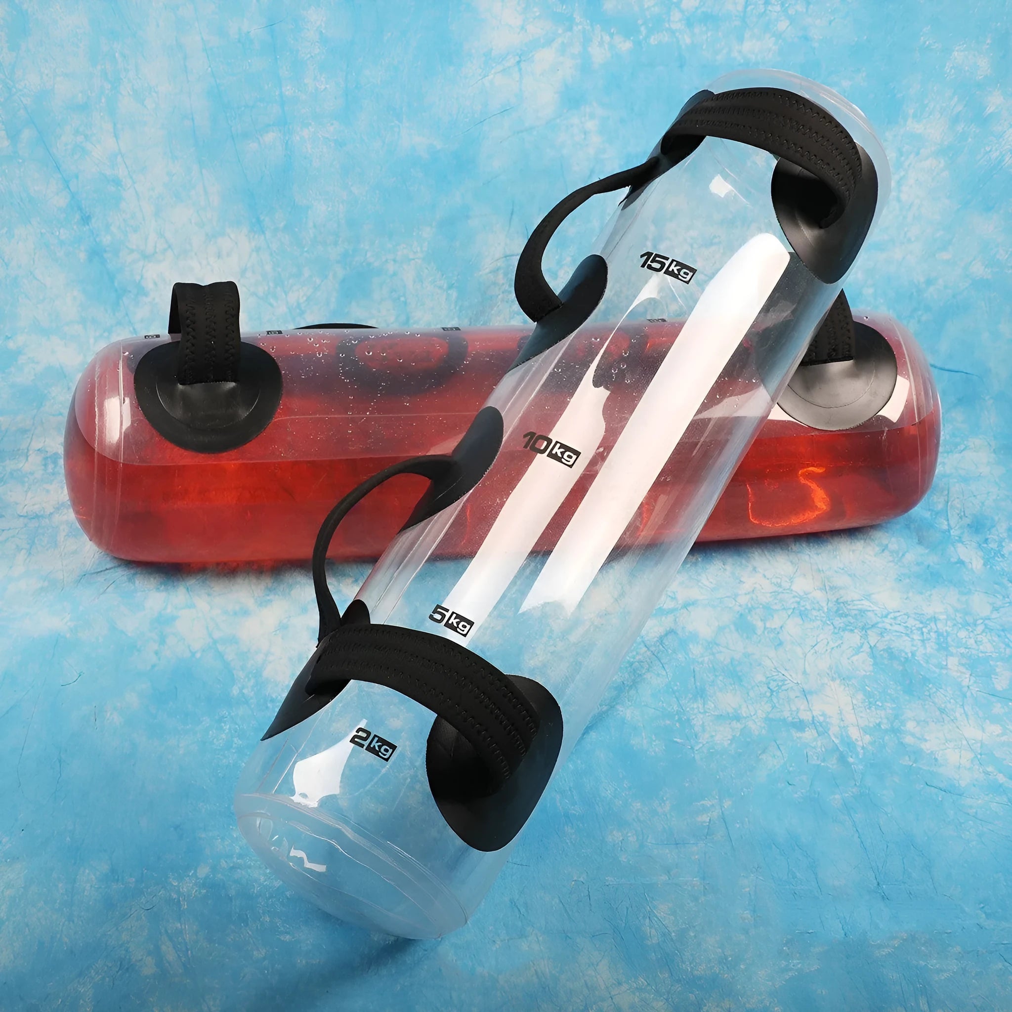 Transparent PVC inflatable weight lifting bag filled with water, showing weight scale options from 5kg to 35kg.