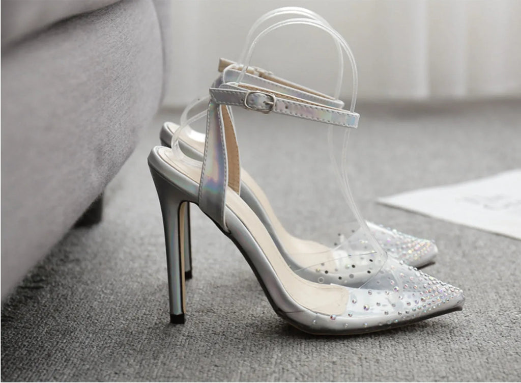 Women's pointed toe diamond sandals with a clear stiletto heel on a white background.
