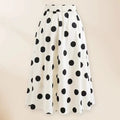 Black one-piece women's swimsuit with a flared round skirt and a decorative bow on the front.