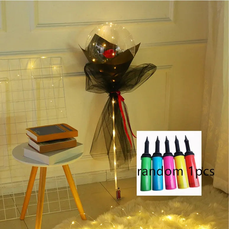 Transparent LED luminous balloon bouquet with artificial rose and glowing light inside, displayed as a DIY kit.