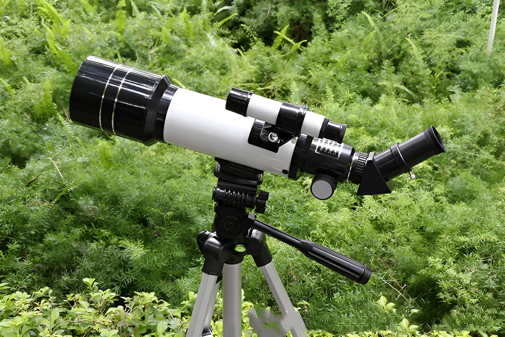 Dark blue children's astronomical telescope on a tripod with 16X-66X magnification.