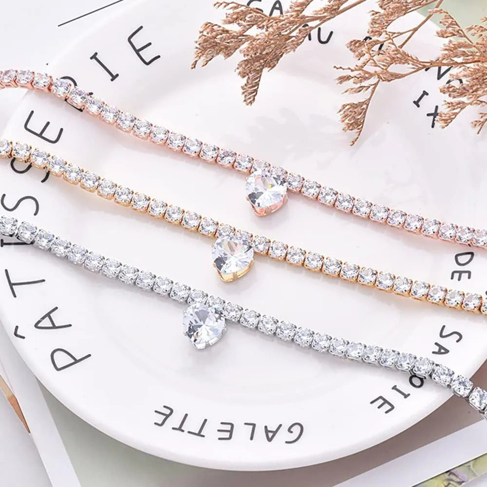 Gold rhinestone heart-shaped collar for dogs and cats with shiny stones and metal extension chain.
