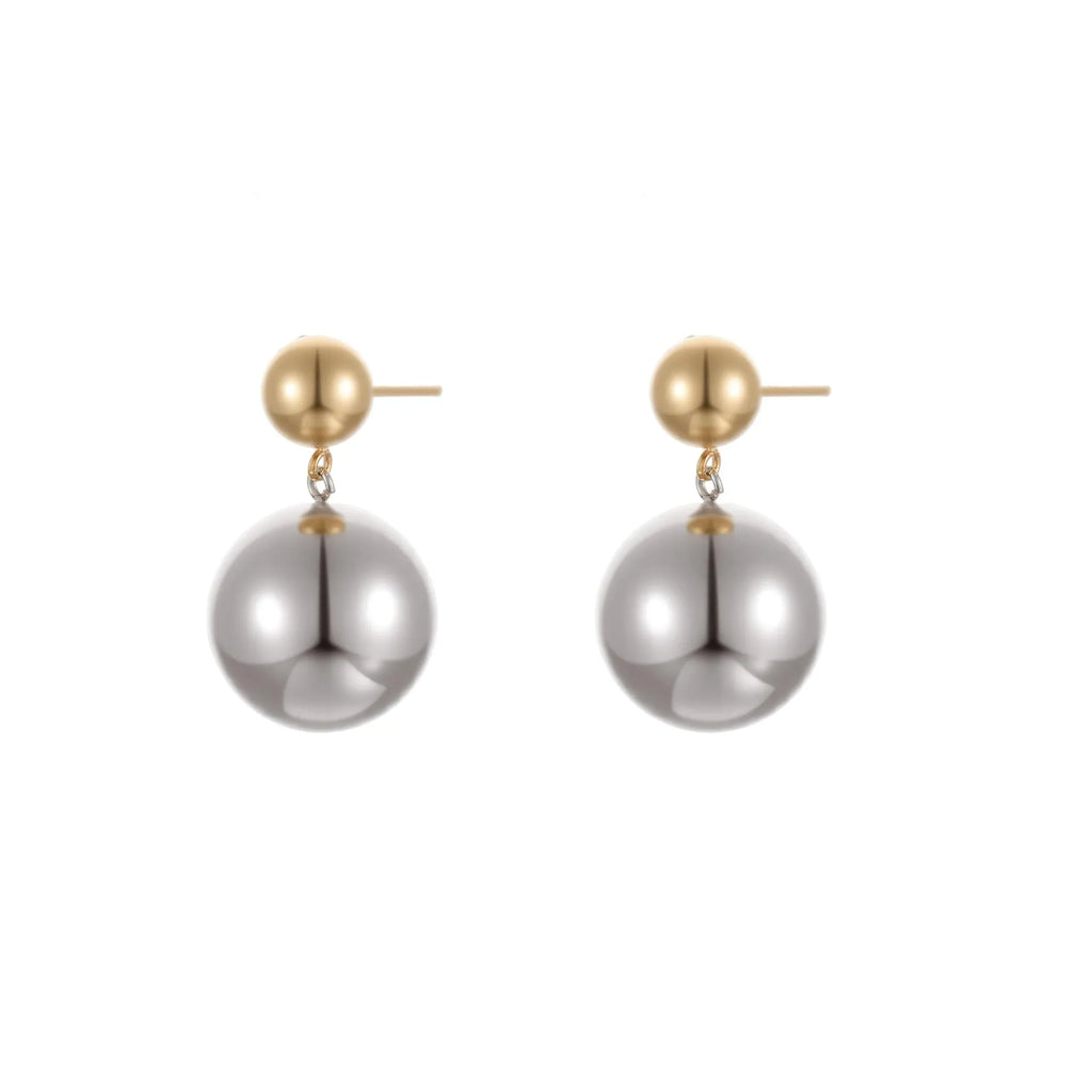 A pair of stainless steel stud earrings with 18K gold electroplated colour-block finish and round bead geometry design.