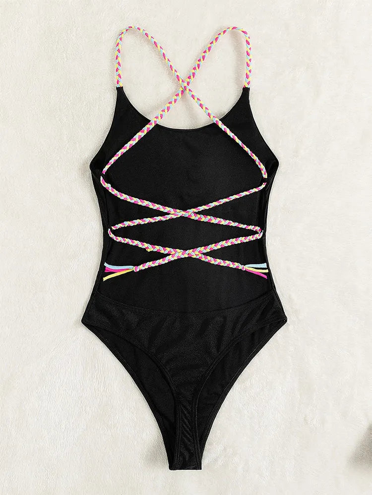 Black one-piece swimsuit for women with backless design and sleeveless cut on mannequin