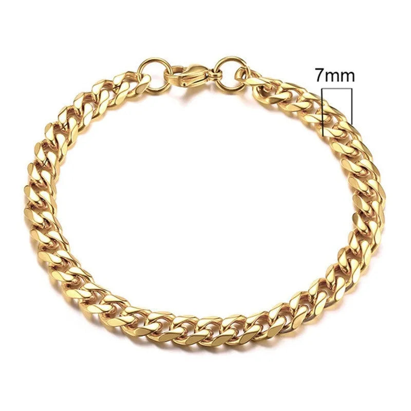 Six-sided geometric link metal bracelet in gold colour on a wrist.