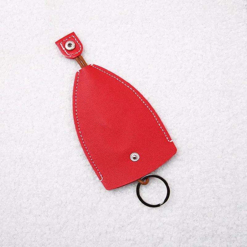 Cartoon pull-out car key case in PU leather with colourful designs measuring 14 x 7.5 cm