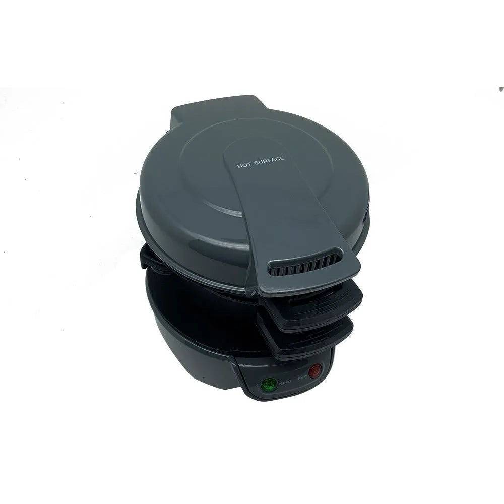 Silver grey household breakfast machine sandwich toaster with waffle plates and egg cooker ring on a kitchen counter.