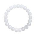 White Hetian jade barrel bead bracelet on a wrist, showing unisex casual style.