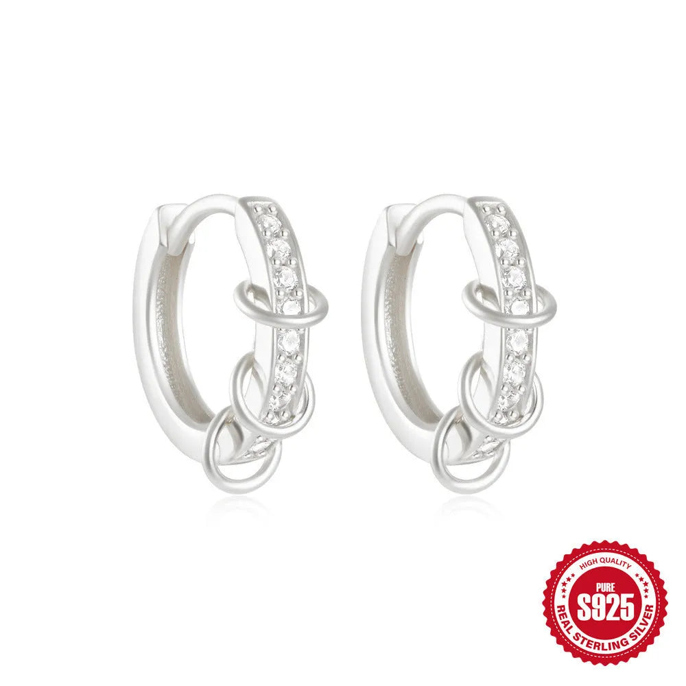 Sterling silver geometric stud earrings with small round diamond detailing in gold and silver electroplated finishes