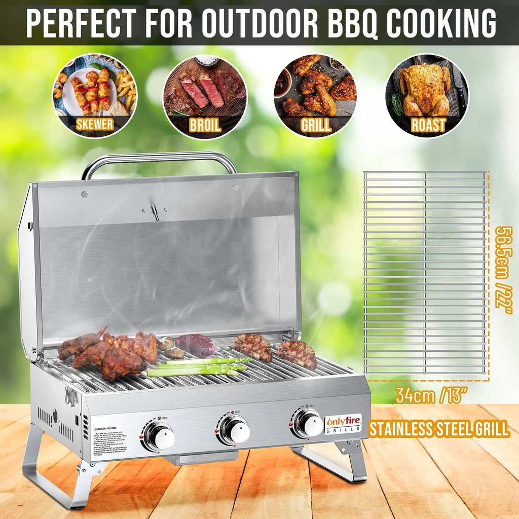 Silver stainless steel desktop gas barbecue grill with three burners and foldable legs