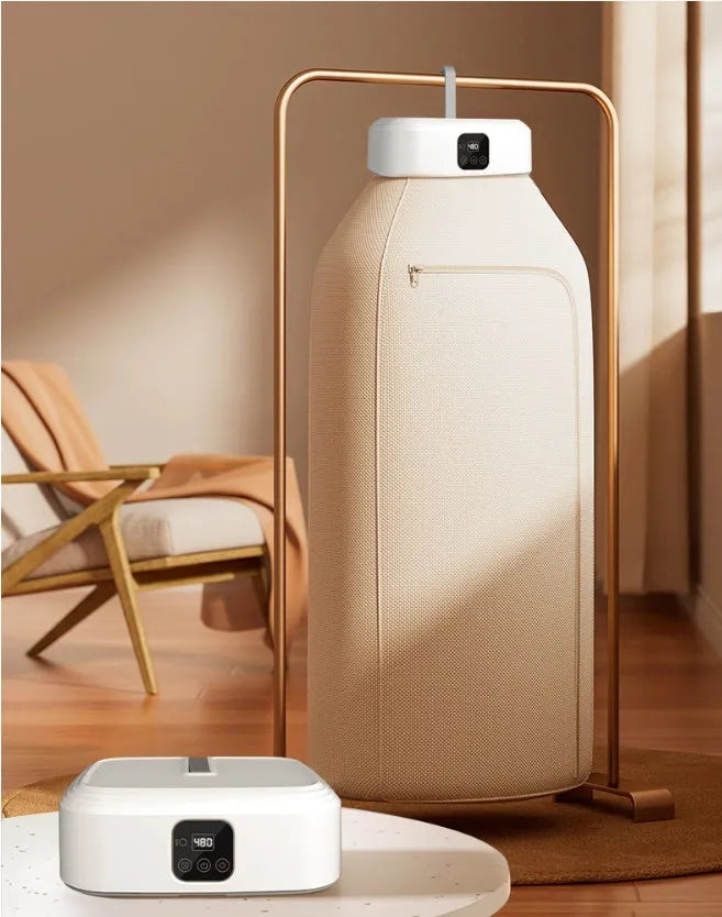 White foldable portable clothes dryer with remote control on countertop