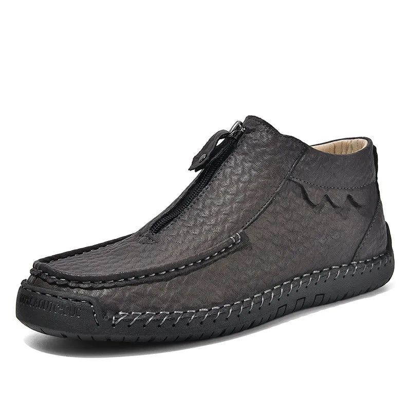 Men's black slip-on loafers with round toe and low heel design showing sewing detail on PU upper