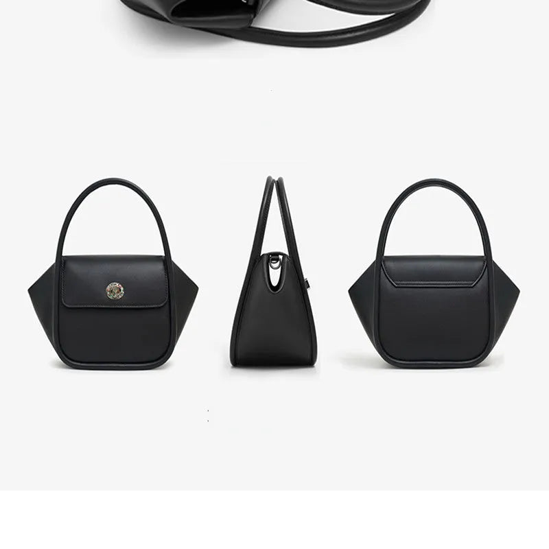 A soft cow leather wing-shaped tote handbag with a buckle and shoulder strap in black.