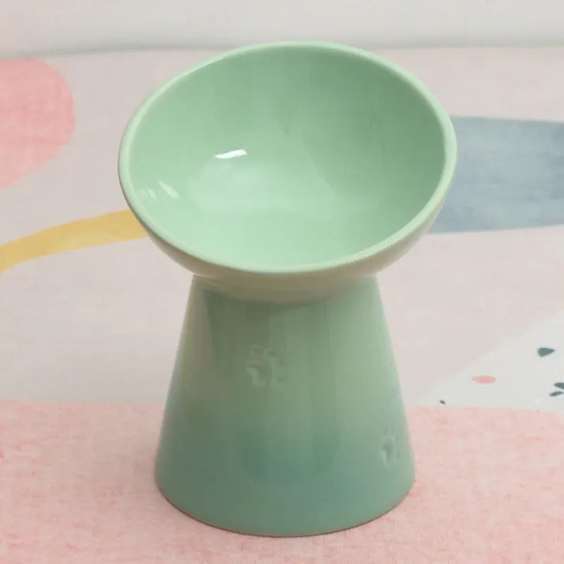 Ceramic pet bowl with anti-tumble design and raised chin support for cats and dogs