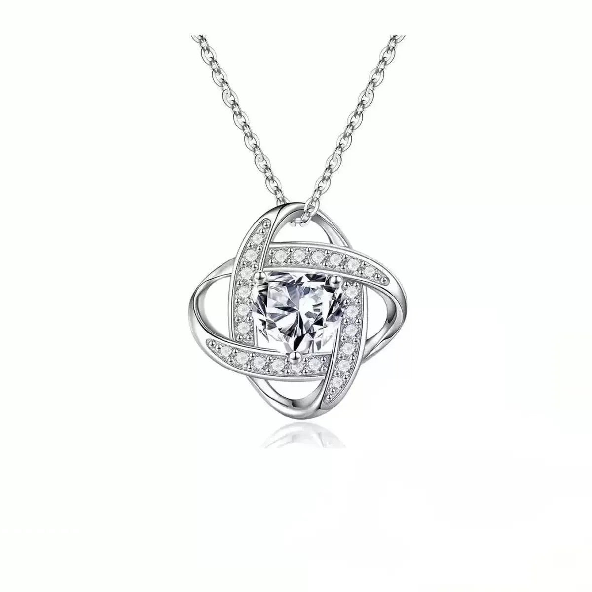 Copper heart necklace with electroplated platinum finish showing multiple colour variations
