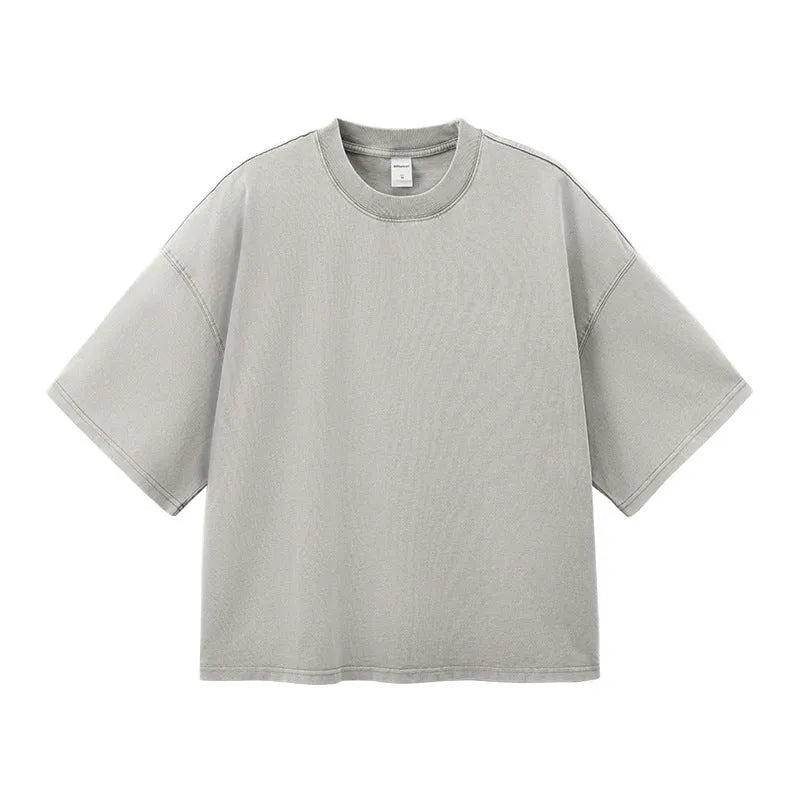 Men's vintage cotton t-shirt with washed-out treatment in khaki light colour showing loose fit and drop-shoulder sleeves