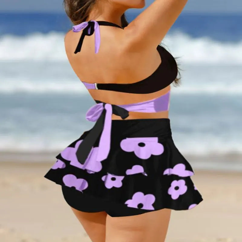 Women's purple lace-up backless bikini set with high-waisted skirt for swimming