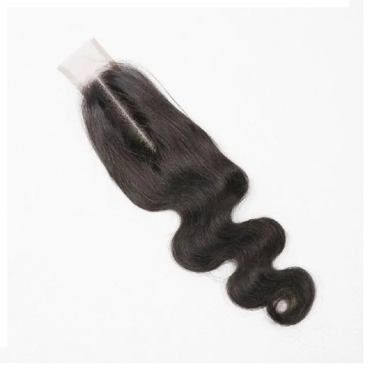 Straight natural colour human hair wig on a stand, showing hand-woven cap and long length.