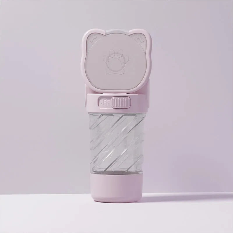 Green, pink, or white 3-in-1 portable pet water bottle with attached strap, food container, and bag dispenser.