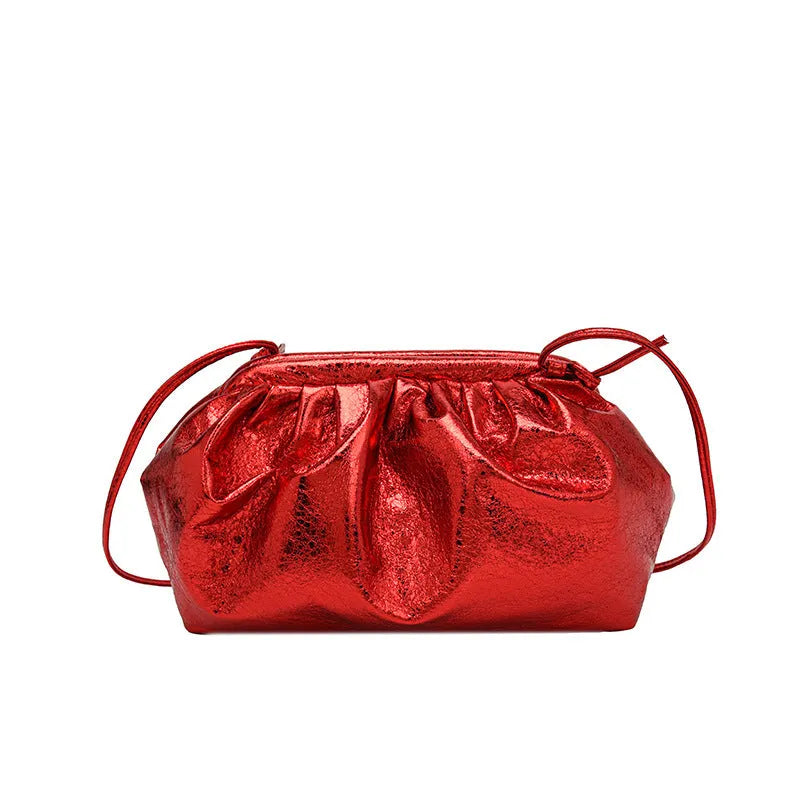 Simple hair clip shoulder crossbody bag in shell shape with sewing line details, shown in rose red colour.