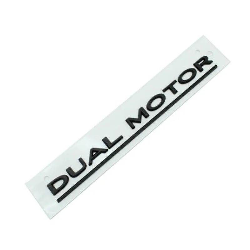 Tesla Model 3 black and red ABS plastic bumper sticker measuring 19cm by 3cm.
