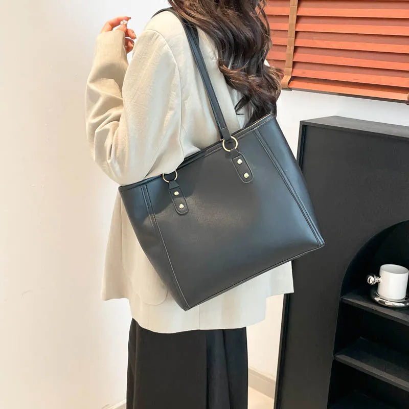 PU leather tote bag with contrast colour trim and internal mobile phone and document compartments