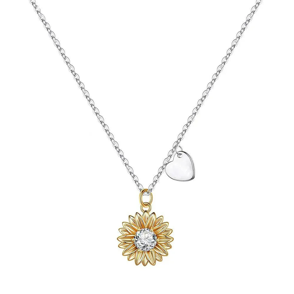 Sterling silver sunflower necklace with adjustable chain on white background