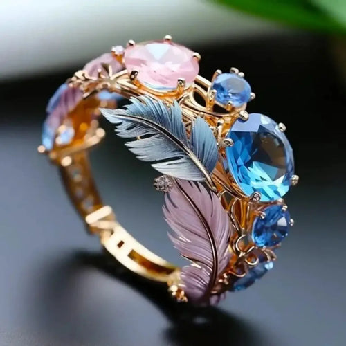 Brass feather ring with embossed geometric design and zircon inlay in gold colour