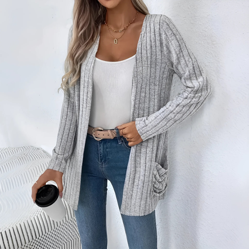 Women's loose-fit long sleeve cardigan with pockets in granny grey, shown on a hanger.