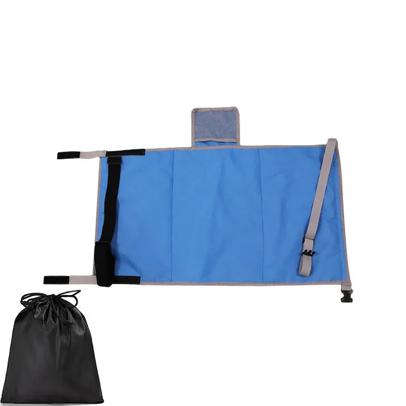 Portable grey nylon children's aircraft seat pedal extender with a matching drawstring pocket.