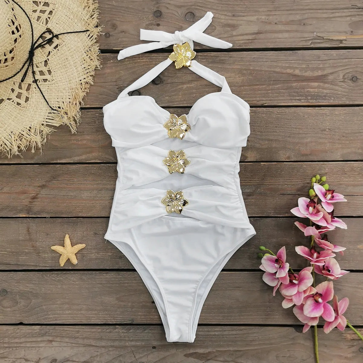 Women's black one-piece swimsuit with matching skirt and hollow-out tube top design