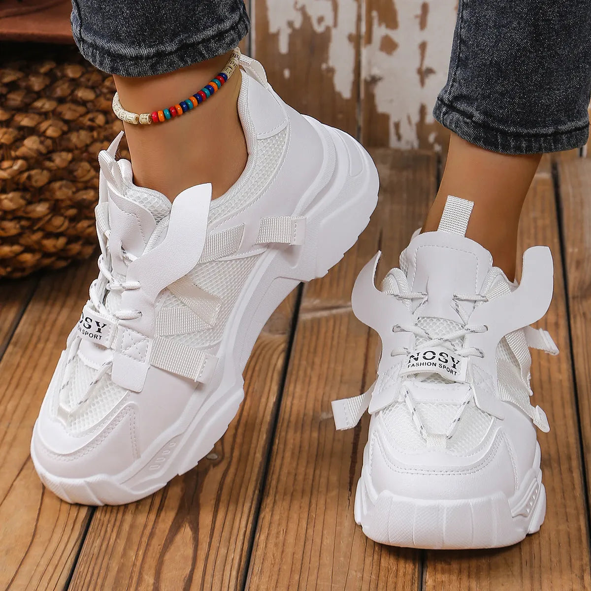 Women's purple platform mesh sports shoe with lace-up front and thick sole for height increase.