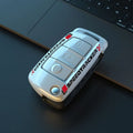 Carbon fibre style car key cover with mirrored finish in white and carbon colour options